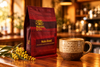 Marnka & Co. Maka Blend bag beside a latte on a café counter with golden wattle