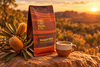 Marnka & Co. Waangara Blend bag and espresso cup on a rock at sunset with banksia