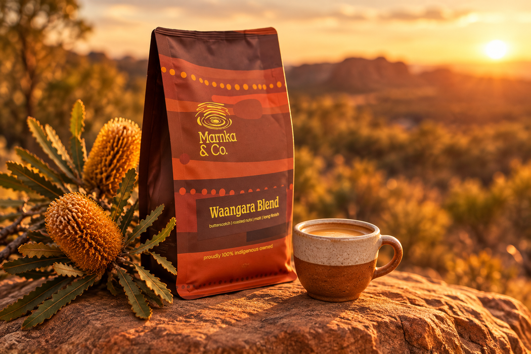 Marnka & Co. Waangara Blend bag and espresso cup on a rock at sunset with banksia